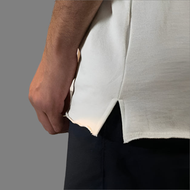 White oversized t-shirt with bold black text design, modeled against a minimal background, perfect for a casual and stylish look.